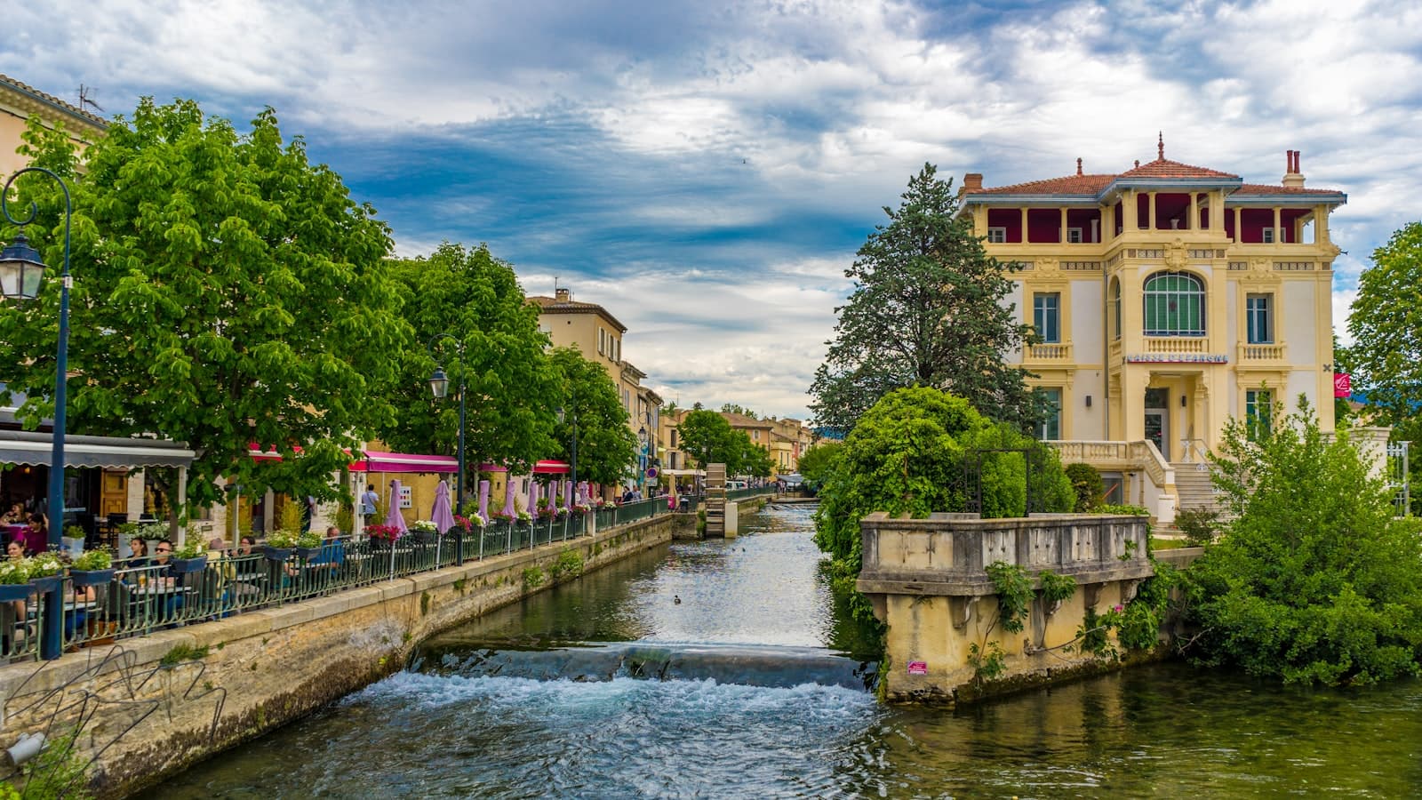 Fontaine-de-Vaucluse — people walking on bridge over river during daytime
