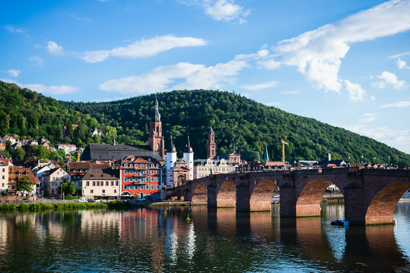 Heidelberg — brown concrete bridge over river during daytime